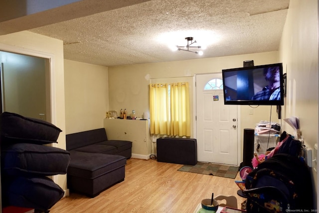 11 Kenneth Cir, Windsor, CT 06095 - living room featuring wood finished floors and a textured ceiling