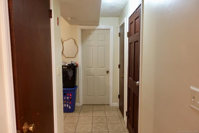 11 Kenneth Cir, Windsor, CT 06095 - hall with light tile patterned flooring and a textured ceiling
