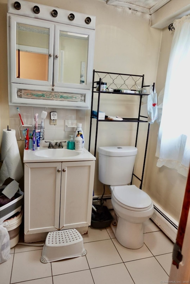 11 Kenneth Cir, Windsor, CT 06095 - half bathroom with a baseboard heating unit, tile patterned floors, and vanity