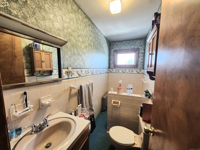 8 Park Ave, Enfield, CT 06082 - bathroom with wallpapered walls, tile walls, a wainscoted wall, vanity, and radiator heating unit