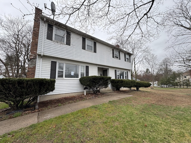 829 Windsor Ave, Windsor, CT 06095 - colonial house with a chimney and a front lawn
