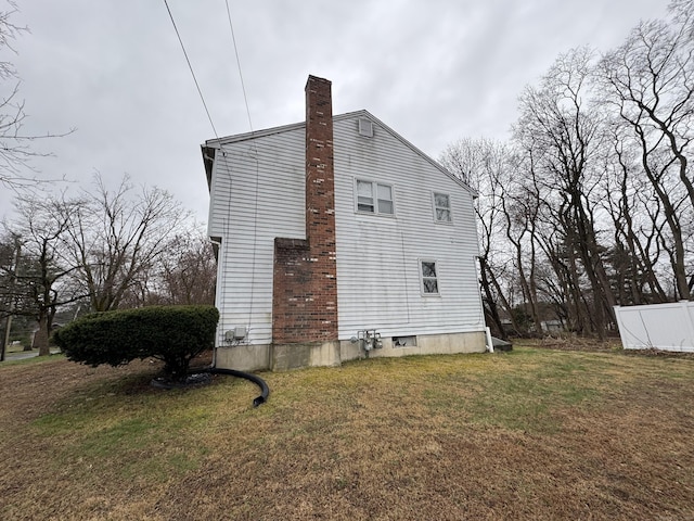 829 Windsor Ave, Windsor, CT 06095 - view of side of property featuring a chimney