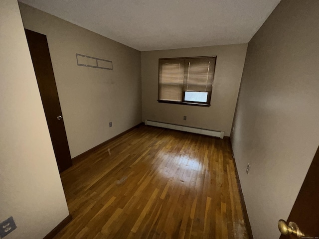 829 Windsor Ave, Windsor, CT 06095 - spare room with baseboard heating and hardwood / wood-style floors