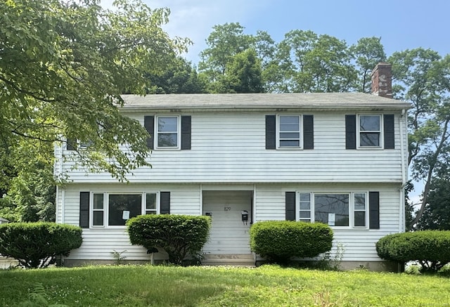 829 Windsor Ave, Windsor, CT 06095 - colonial-style house with a chimney and a front lawn