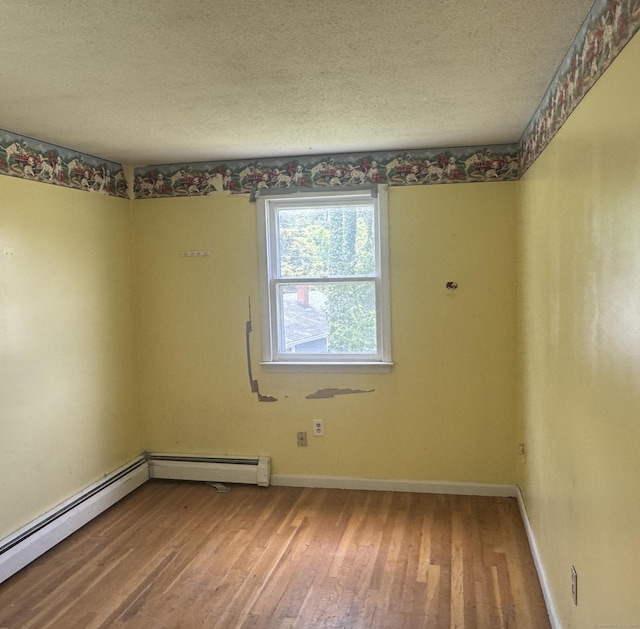 829 Windsor Ave, Windsor, CT 06095 - spare room featuring a textured ceiling, a baseboard radiator, and wood finished floors