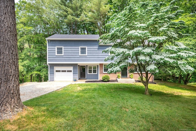 39 Aspen Mill Rd, Ridgefield, CT 06877 - colonial home with driveway, an attached garage, and a front yard