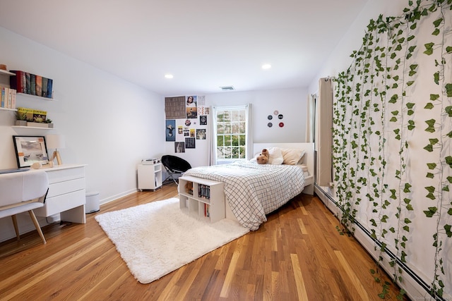 39 Aspen Mill Rd, Ridgefield, CT 06877 - bedroom featuring an office area, light wood-type flooring, a baseboard radiator, and recessed lighting