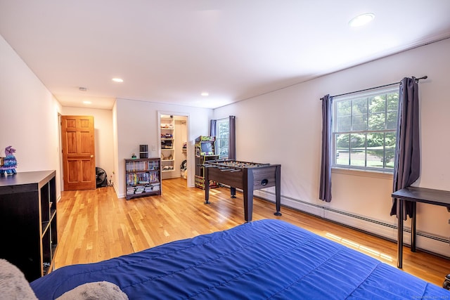 39 Aspen Mill Rd, Ridgefield, CT 06877 - bedroom featuring multiple windows, light wood finished floors, a baseboard heating unit, and recessed lighting