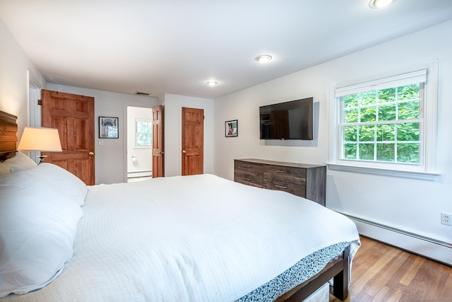 39 Aspen Mill Rd, Ridgefield, CT 06877 - bedroom with baseboard heating, wood finished floors, a baseboard radiator, and recessed lighting