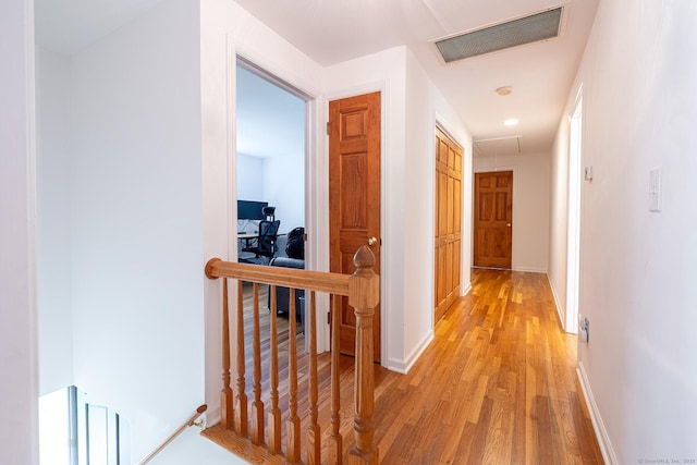 39 Aspen Mill Rd, Ridgefield, CT 06877 - hallway with light wood-style flooring and an upstairs landing