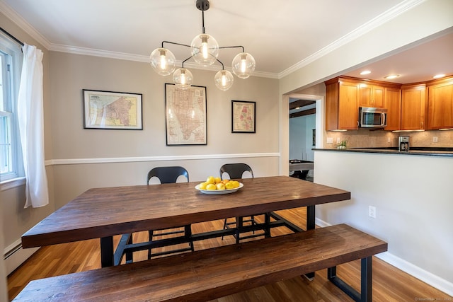 39 Aspen Mill Rd, Ridgefield, CT 06877 - dining room featuring wood finished floors, ornamental molding, and a baseboard radiator