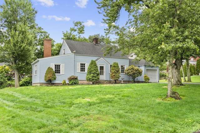 5 Skiff Pkwy, North Haven, CT 06473 - view of front of home featuring a chimney, a front lawn, and an attached garage