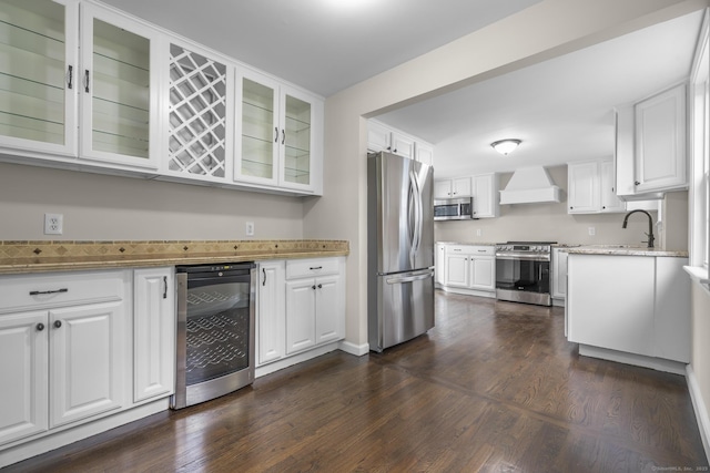 5 Skiff Pkwy, North Haven, CT 06473 - kitchen with beverage cooler, appliances with stainless steel finishes, premium range hood, and white cabinetry