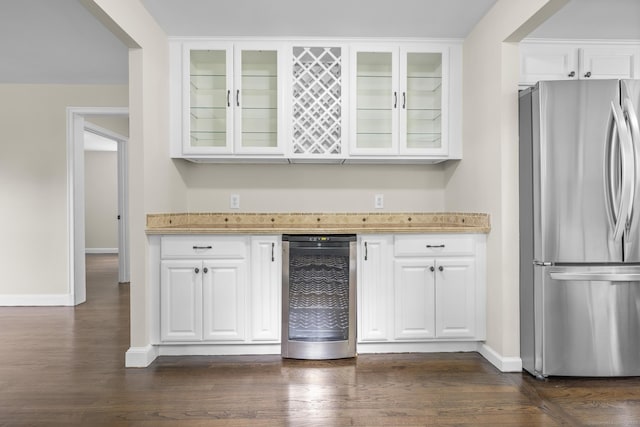 5 Skiff Pkwy, North Haven, CT 06473 - kitchen with freestanding refrigerator, wine cooler, dark wood-style flooring, and white cabinetry