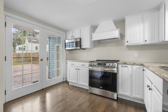 5 Skiff Pkwy, North Haven, CT 06473 - kitchen with appliances with stainless steel finishes, custom exhaust hood, dark wood-style floors, and white cabinets