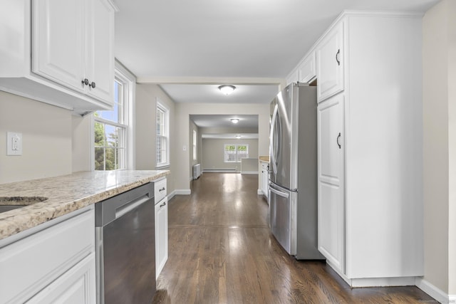 5 Skiff Pkwy, North Haven, CT 06473 - kitchen featuring stainless steel appliances, white cabinets, dark wood-style floors, and light stone countertops