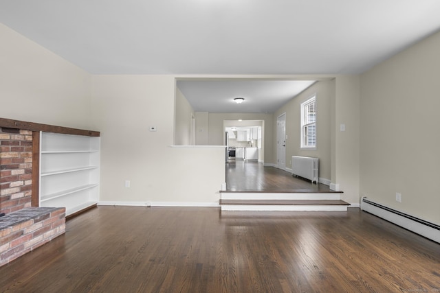 5 Skiff Pkwy, North Haven, CT 06473 - unfurnished living room with radiator heating unit, a baseboard radiator, wood finished floors, and built in shelves