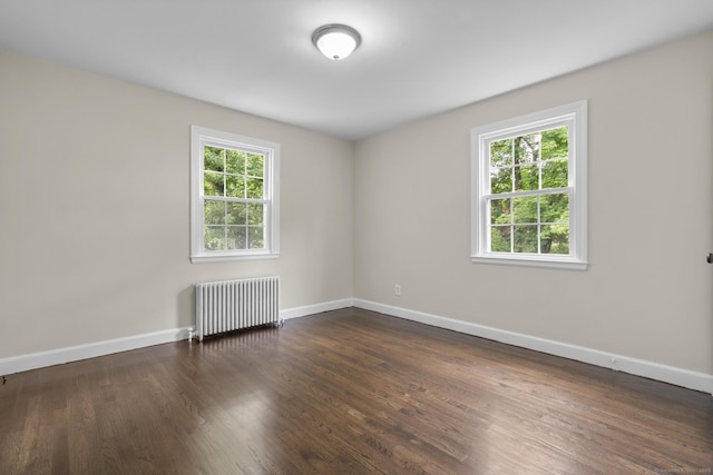 5 Skiff Pkwy, North Haven, CT 06473 - empty room with radiator and dark wood finished floors