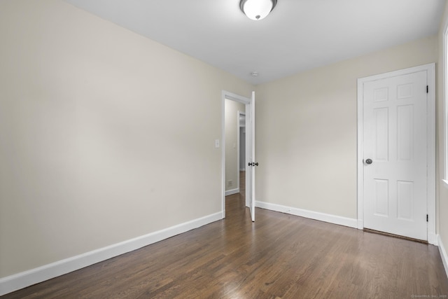 5 Skiff Pkwy, North Haven, CT 06473 - unfurnished bedroom with dark wood-type flooring and baseboards