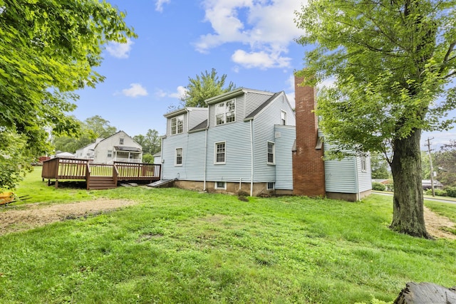 5 Skiff Pkwy, North Haven, CT 06473 - back of house with a deck, a yard, and a chimney