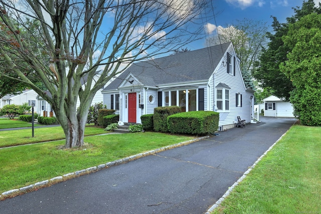 30 Birch St, Stratford, CT 06615 - cape cod-style house with an outbuilding, roof with shingles, and a front lawn