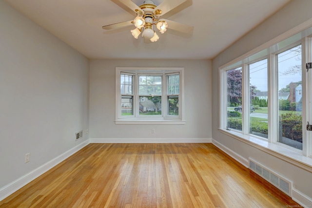 30 Birch St, Stratford, CT 06615 - unfurnished room with light wood finished floors, healthy amount of natural light, and ceiling fan