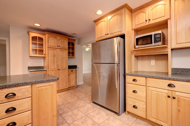 30 Birch St, Stratford, CT 06615 - kitchen featuring appliances with stainless steel finishes, light brown cabinetry, glass insert cabinets, recessed lighting, and light tile patterned floors