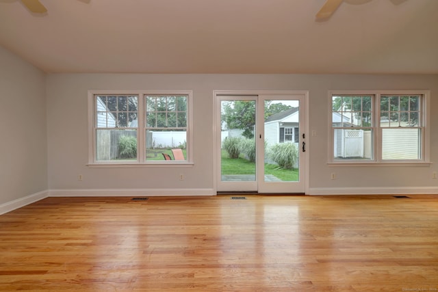 30 Birch St, Stratford, CT 06615 - empty room with ceiling fan, plenty of natural light, and light wood finished floors