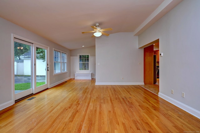 30 Birch St, Stratford, CT 06615 - unfurnished room with lofted ceiling, ceiling fan, light wood-style flooring, and radiator