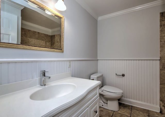 30 Birch St, Stratford, CT 06615 - bathroom featuring ornamental molding, vanity, a wainscoted wall, and tile patterned floors