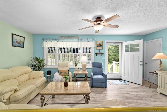 47 Little Bungee Hill Rd, Woodstock, CT 06282 - living area with a textured ceiling, ceiling fan, and wood finished floors