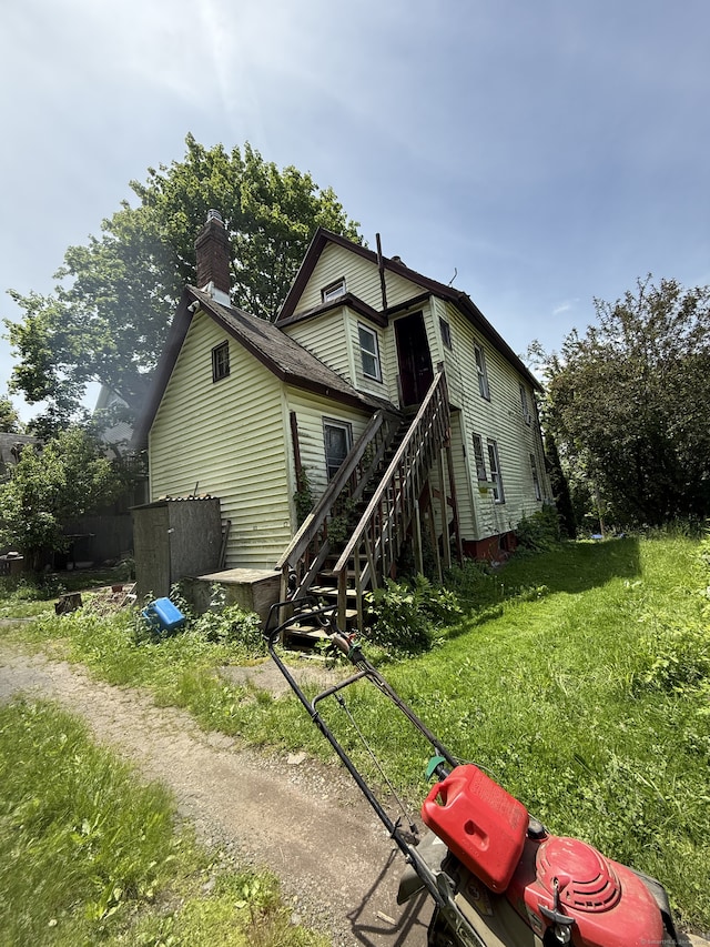 5 Maple Pl, Middletown, CT 06457 - rear view of house with stairs and a chimney