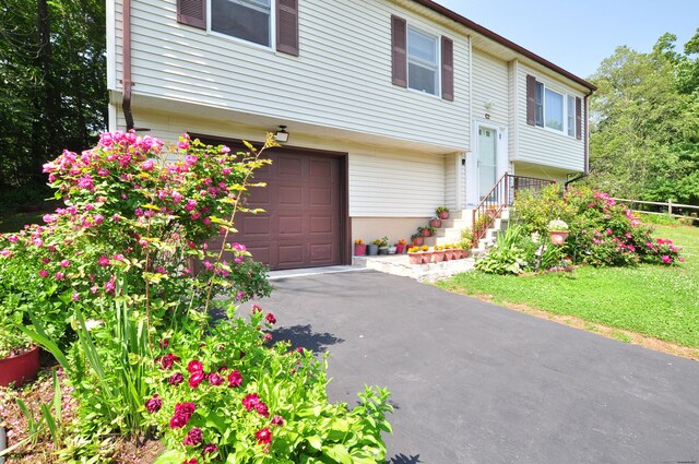 8 Pons Rd, Groton, CT 06355 - split foyer home with a garage and asphalt driveway
