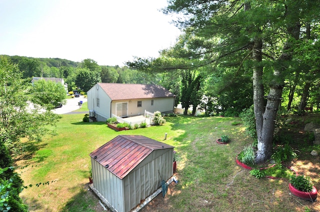 8 Pons Rd, Groton, CT 06355 - view of green lawn featuring a deck and an outdoor structure