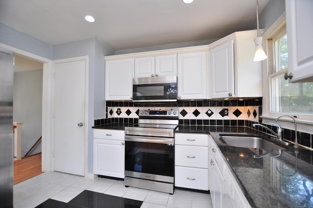 8 Pons Rd, Groton, CT 06355 - kitchen featuring appliances with stainless steel finishes, white cabinetry, decorative backsplash, decorative light fixtures, and recessed lighting