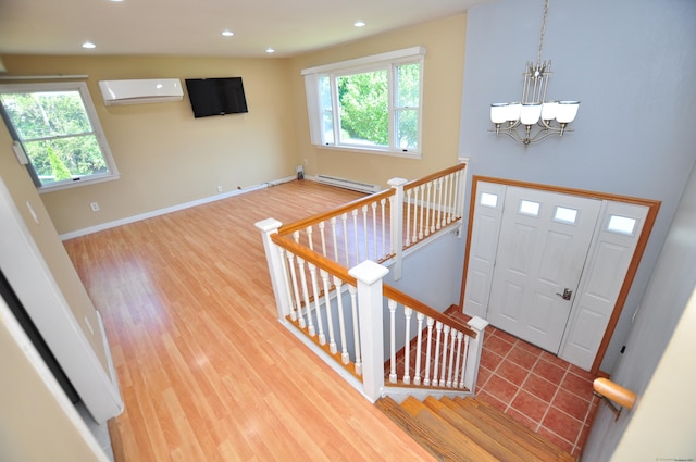 8 Pons Rd, Groton, CT 06355 - entryway with a wall mounted air conditioner, a chandelier, wood finished floors, recessed lighting, and baseboard heating