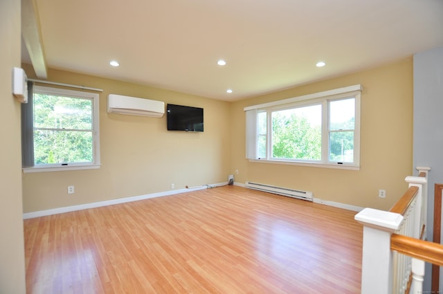 8 Pons Rd, Groton, CT 06355 - empty room with a wall unit AC, a baseboard radiator, healthy amount of natural light, wood finished floors, and recessed lighting