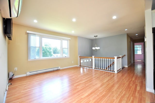 8 Pons Rd, Groton, CT 06355 - empty room with a baseboard heating unit, a chandelier, light wood-style floors, and recessed lighting