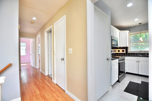 8 Pons Rd, Groton, CT 06355 - kitchen featuring stainless steel electric range, dark countertops, white cabinets, recessed lighting, and decorative backsplash