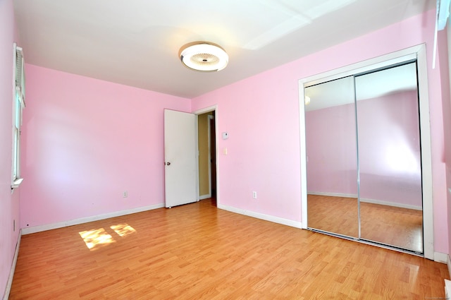 8 Pons Rd, Groton, CT 06355 - unfurnished bedroom with light wood-style floors and a closet