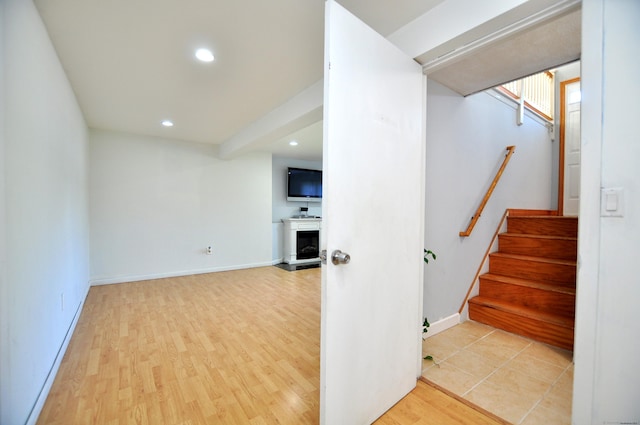 8 Pons Rd, Groton, CT 06355 - below grade area with stairway, recessed lighting, a fireplace, and wood finished floors