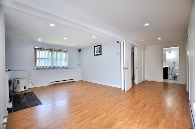 8 Pons Rd, Groton, CT 06355 - unfurnished living room with baseboard heating, light wood finished floors, and recessed lighting