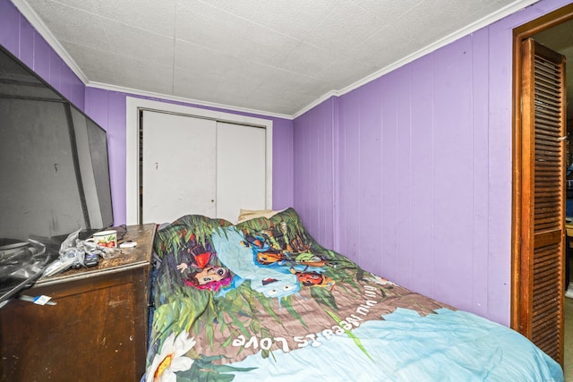 42 Goodwin St, Torrington, CT 06790 - bedroom featuring crown molding, a decorative wall, and a closet