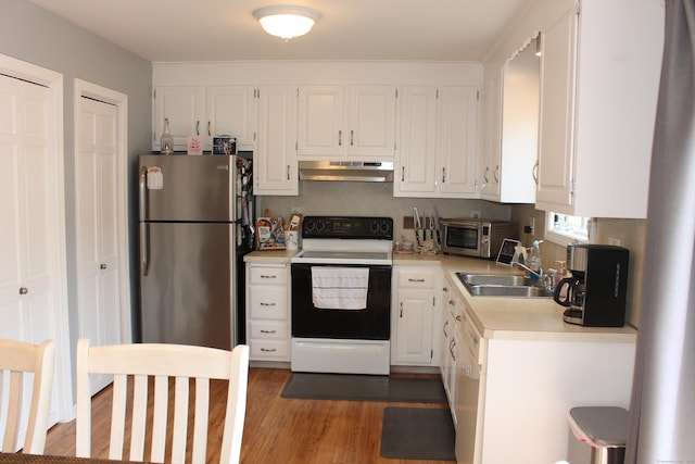 176 Atwater St Apt 7, Southington, CT 06479 - kitchen featuring stainless steel appliances, under cabinet range hood, light countertops, and white cabinets