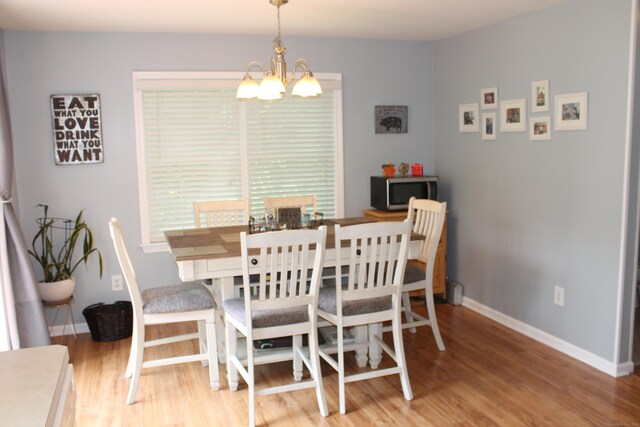 176 Atwater St Apt 7, Southington, CT 06479 - dining space with a chandelier and wood finished floors
