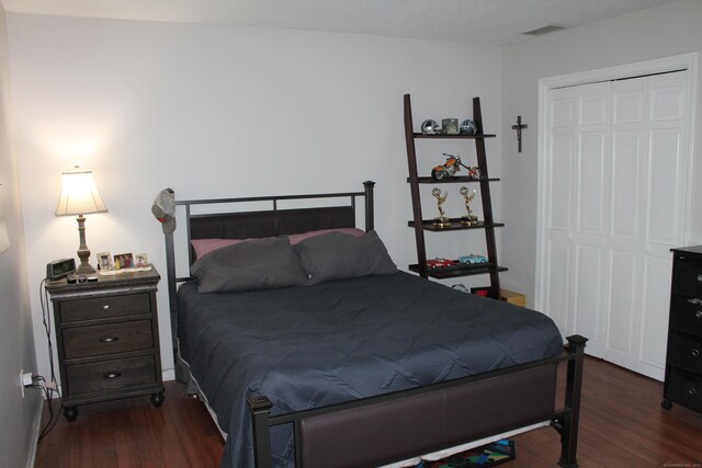 176 Atwater St Apt 7, Southington, CT 06479 - bedroom with dark wood-type flooring and a closet