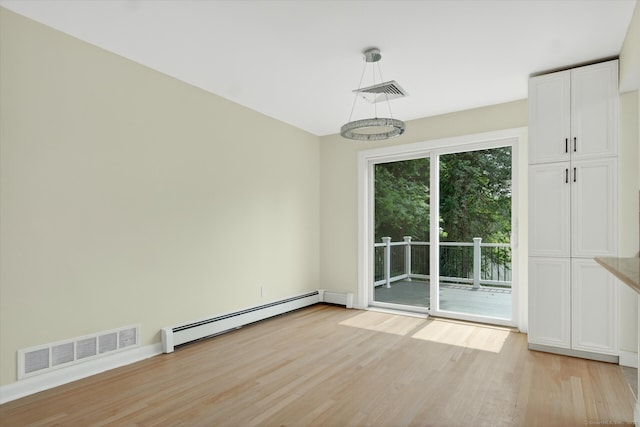 3481 Park Ave, Fairfield, CT 06825 - unfurnished dining area with a baseboard heating unit and light wood-type flooring