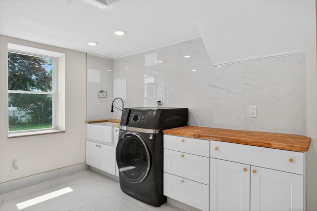3481 Park Ave, Fairfield, CT 06825 - washroom featuring light marble finish floors, washer / dryer, tile walls, cabinet space, and recessed lighting