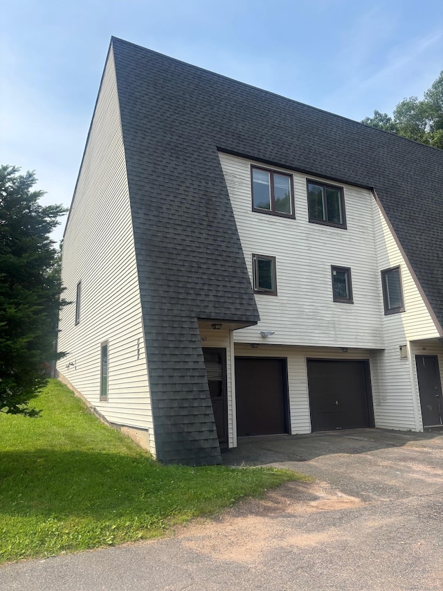 167 High Top Cir W Unit 167, Hamden, CT 06514 - view of front of house featuring a garage, asphalt driveway, and roof with shingles
