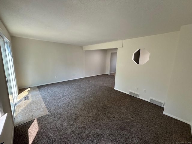 167 High Top Cir W Unit 167, Hamden, CT 06514 - empty room featuring dark colored carpet and a textured ceiling